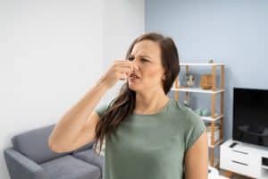 Woman Covering Her Nose